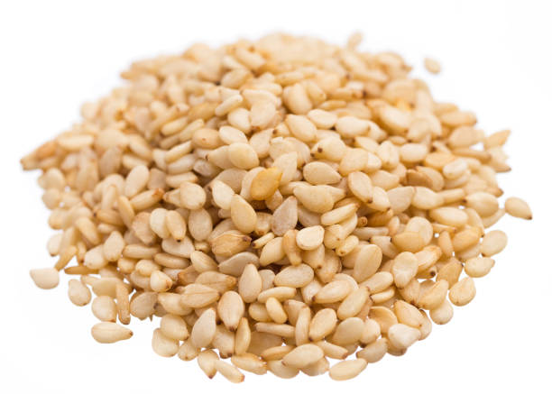 istock Sesame. Pile of grains, isolated white background. 872652386