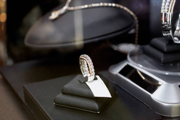 istock Diamond rings in jewelry luxury store window display 872656124