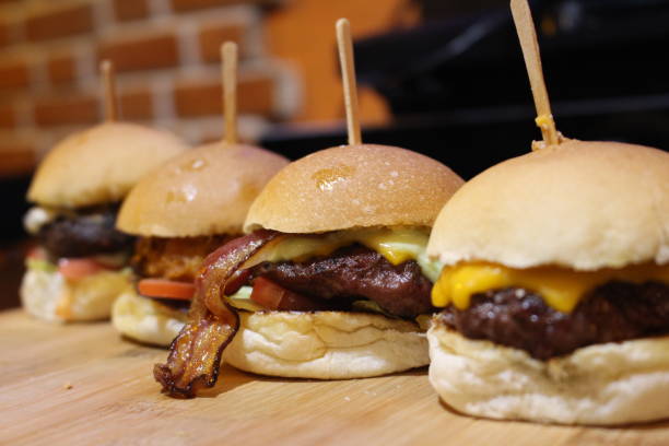 istock mini burgers in line 872656726