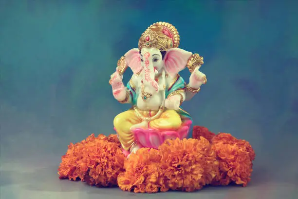 Indian Hindu God Ganesha with Flowers