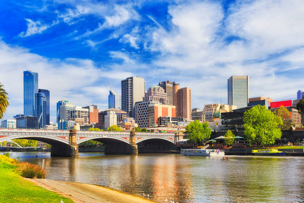 Me Princes Bridge East Day Princes bridge in Melbourne city across Yarra river on a sunny day in view of high-rise towers and modern urban architecture. south yarra stock pictures, royalty-free photos & images