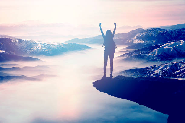 istock Woman Silhouette at sunset on hill 872663462