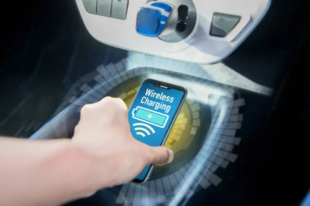 Wireless charging of smart phone in vehicle.