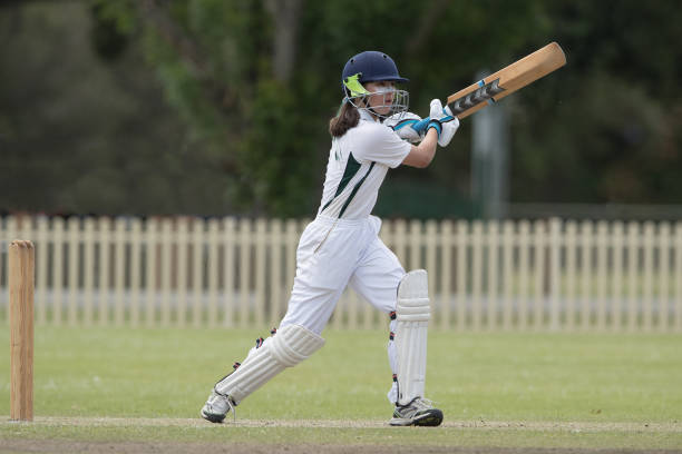 istock Girl playing cricket 872676522