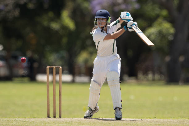 istock Girl playing cricket 872676542