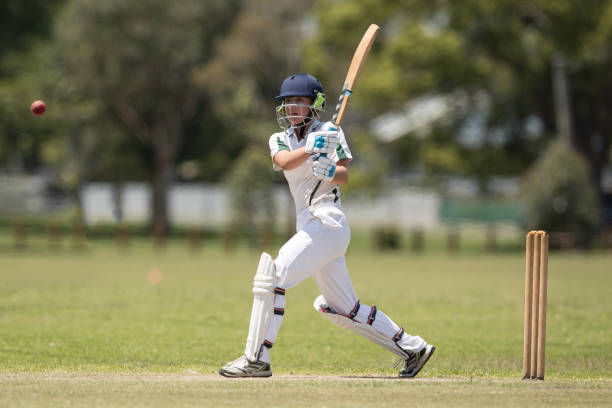 istock Girl playing cricket 872676582