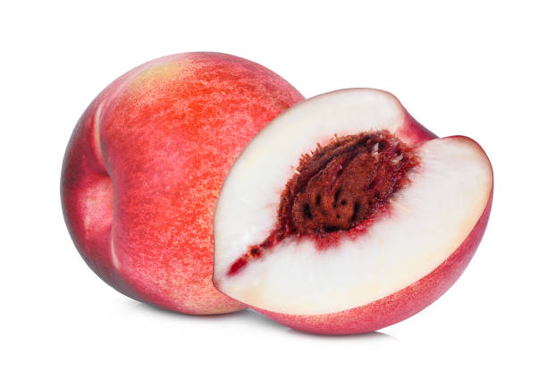 whole and half of nectarine fruit isolated on whitie background whole and half of nectarine fruit isolated on whitie background nectarine stock pictures, royalty-free photos & images