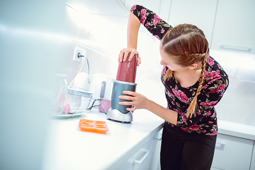 Girl With Braids Making Smoothie at Home in The Morning