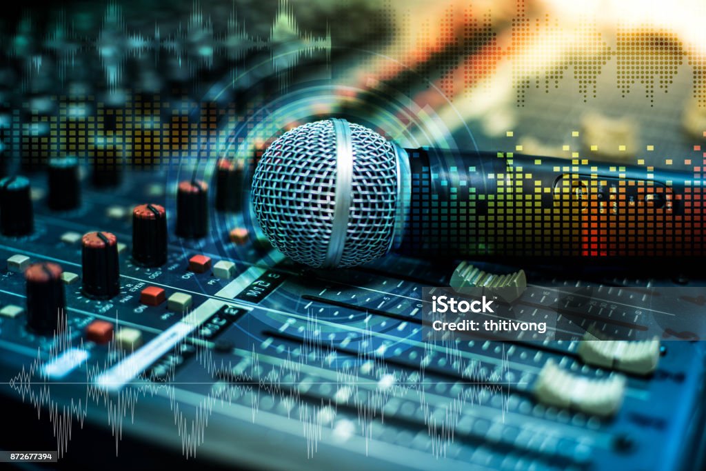 Microphone over the Abstract blurred on sound mixer out of focus background Abstract Stock Photo