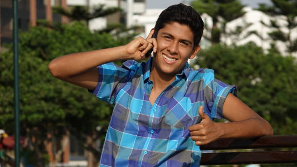 istock Teen Boy Success Phone Call 872683422