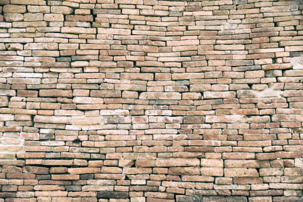 istock Decorative orange brick wall.Red aged brick wall texture. Building background.Vintage historical old brick wall background 872684614