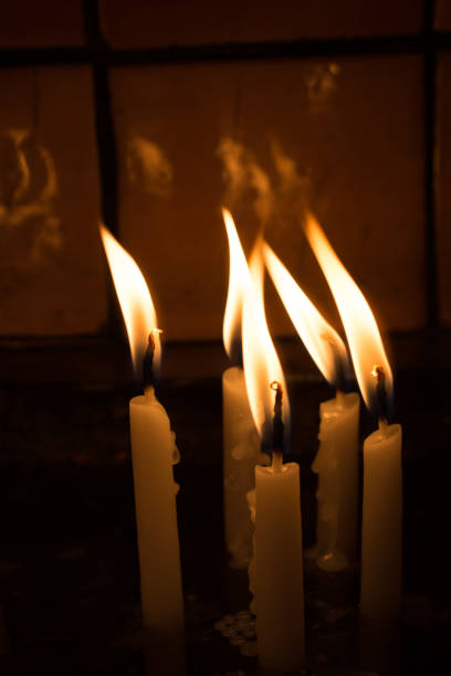 istock Burning candles give light in the dark 872691572