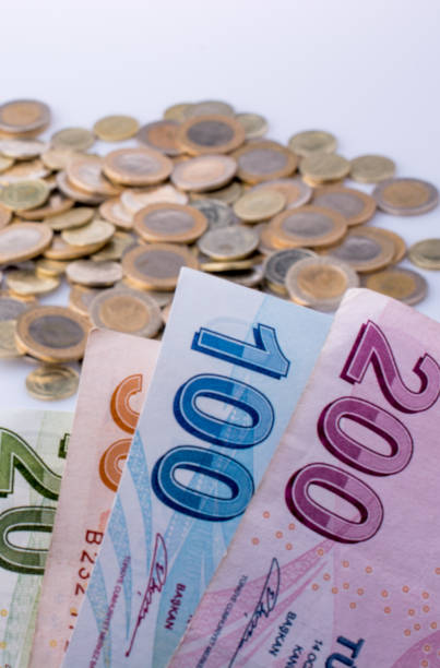 istock Turkish Lira coins and banknotes side by side 872691604