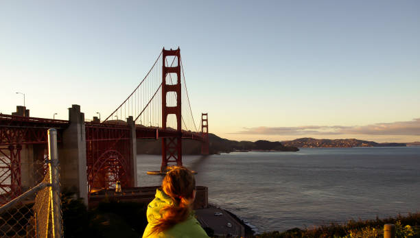 istock Woman Cycling Over Golden Gate 872694366