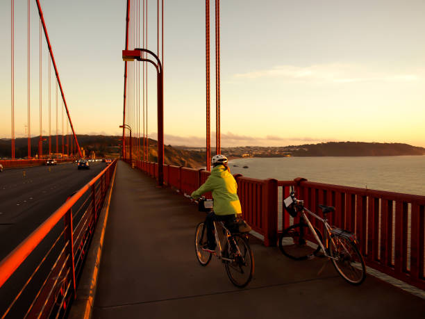 istock Woman Cycling Over Golden Gate 872694430