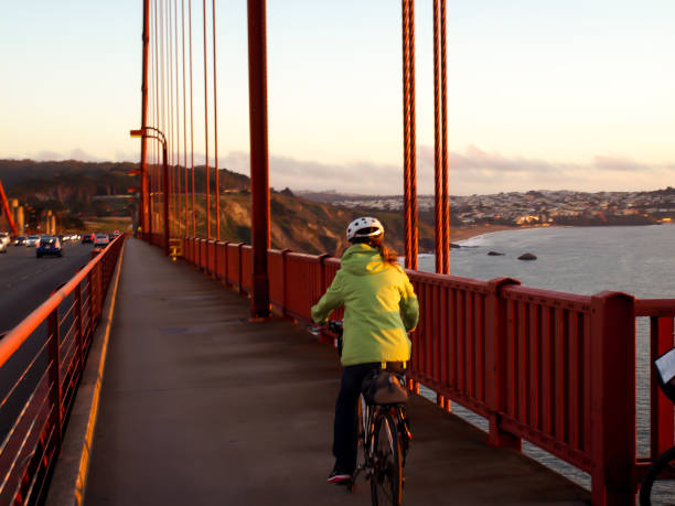 istock Woman Cycling Over Golden Gate 872694446
