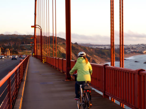 istock Woman Cycling Over Golden Gate 872694480
