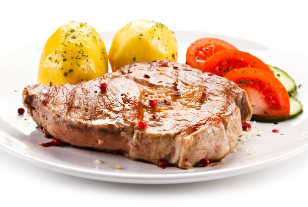 istock Grilled steak with boiled potatoes and vegetables 872700722