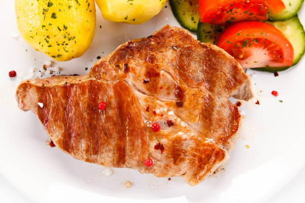Grilled steak and vegetable salad on white background