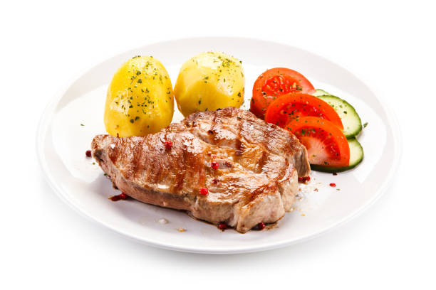 istock Grilled steak with boiled potatoes and vegetables 872700848