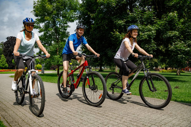 istock Urban biking- three people riding bikes in city 872704548