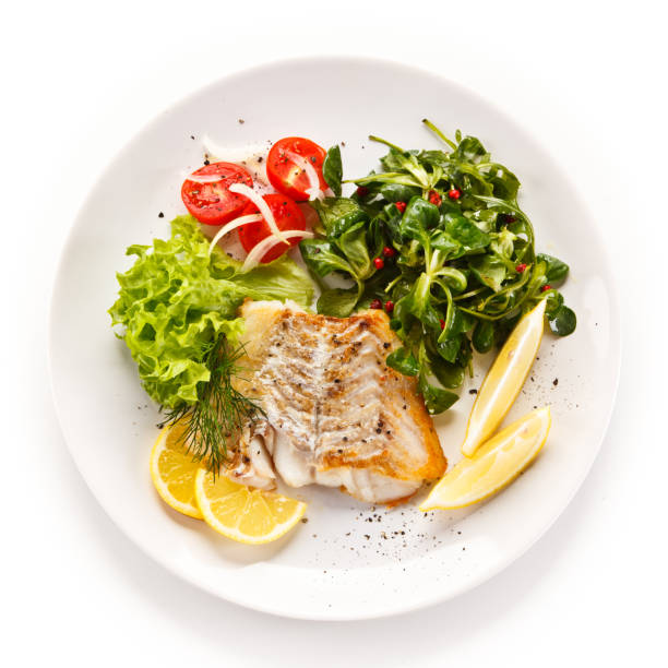 istock Fish dish - fried fish fillet and vegetables 872714152