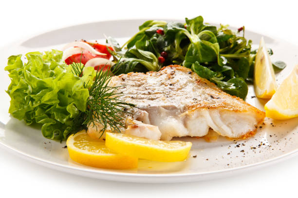 istock Fish dish - fried fish fillet and vegetables 872714368