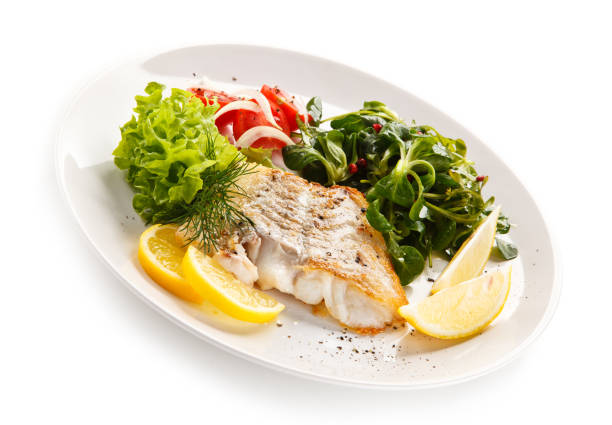 istock Fish dish - fried fish fillet and vegetables 872714422