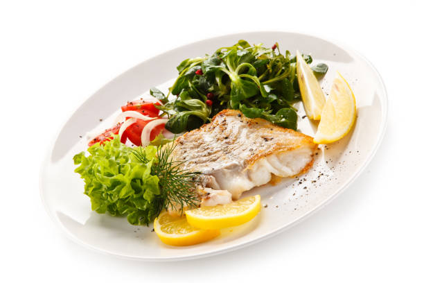 istock Fish dish - fried fish fillet and vegetables 872714462