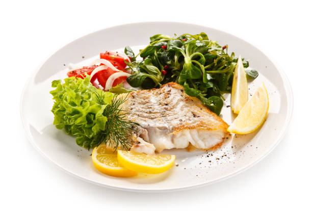 istock Fish dish - fried fish fillet and vegetables 872714544