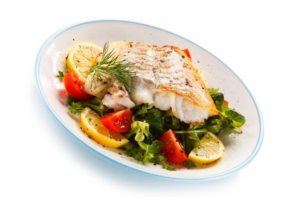 istock Fish dish - fried fish fillet and vegetables 872714636