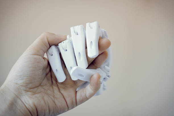 Robot hand fingers from plastic Robot hand fingers from plastic close-up conceptual handshake 3d printing hand stock pictures, royalty-free photos & images