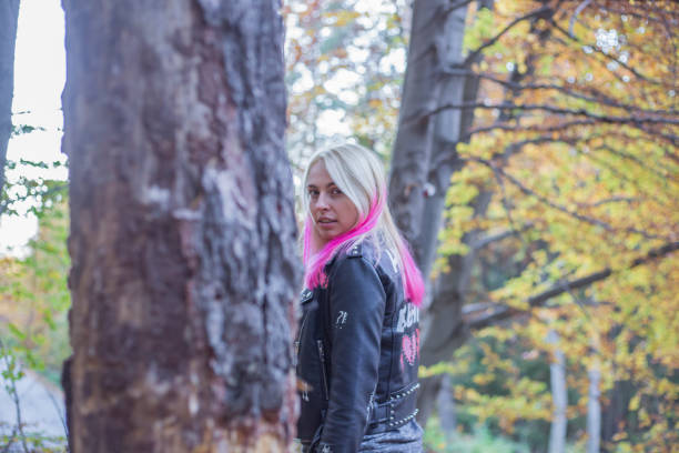 istock woman on leafs in autumn park 872722746