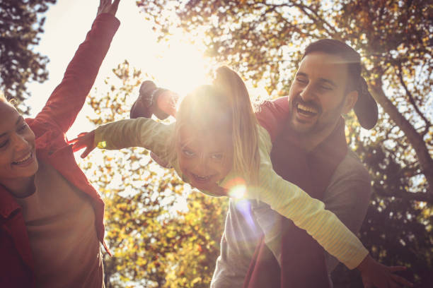 istock Mother and father have fun with daughter. Close up. 872729172