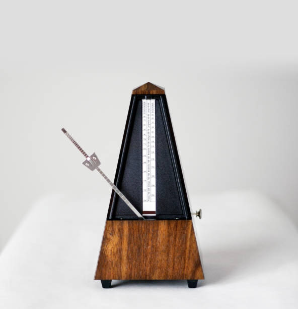 istock Metronome in action, closeup, isolated and on a plain background 872732274