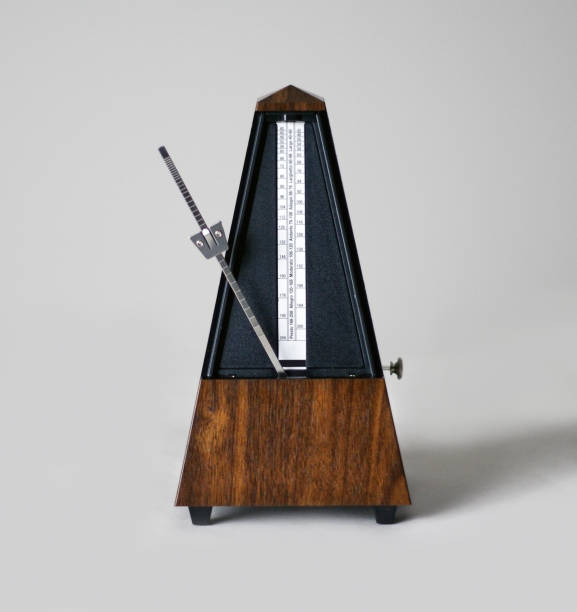 istock Metronome in action, closeup, isolated and on a plain background 872732276