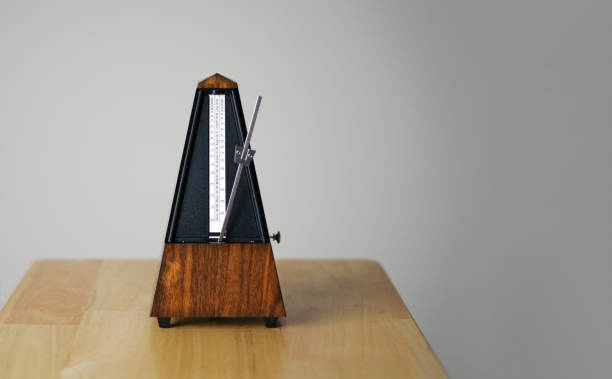 istock Metronome in action, closeup, isolated and on a plain background 872732278