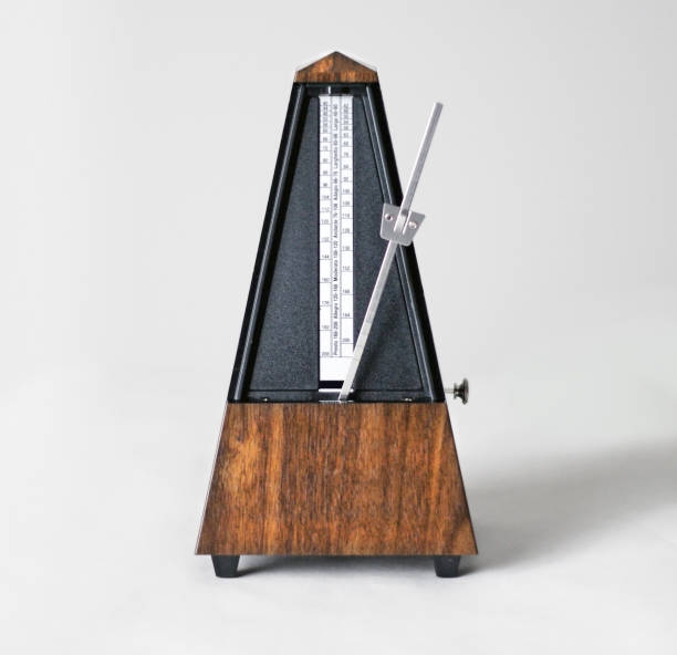 istock Metronome in action, closeup, isolated and on a plain background 872732280