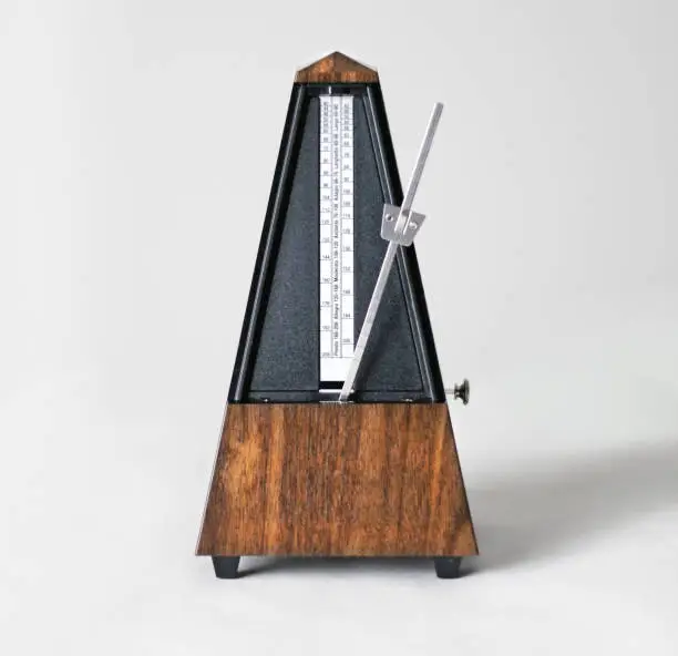 Metronome in action, closeup, isolated and on a plain background. Calgary, Alberta, Canada.