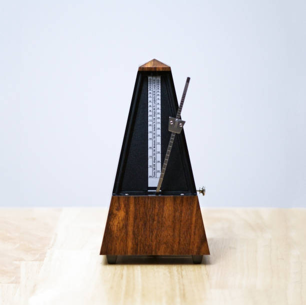 istock Metronome in action, closeup, isolated and on a plain background 872732282