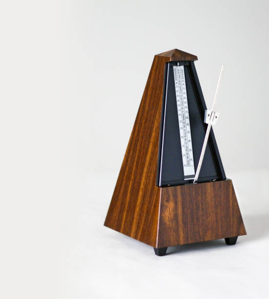 istock Metronome in action, closeup, isolated and on a plain background 872732306