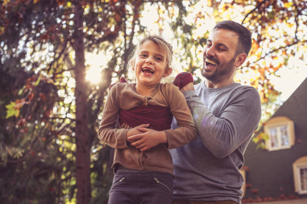 istock Father have play with daughter at backyard. On the move. 872735132
