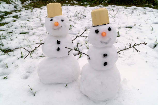 istock Two snowmen handmade in the snow. 872739166