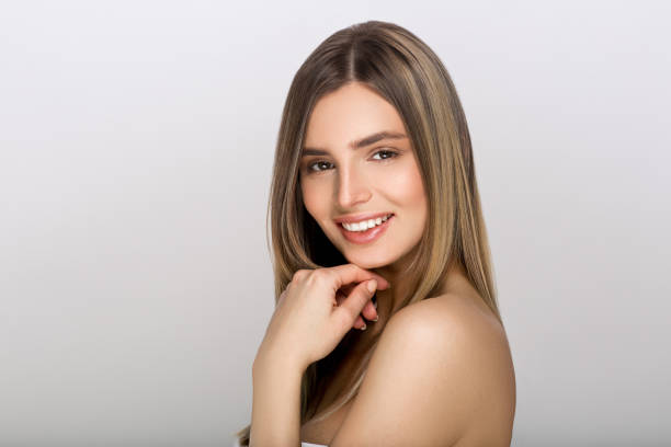 Young woman with beauty skin and beauty hairstyle . Young woman with beauty skin and beauty hairstyle . Studio shot. woman smooth hair stock pictures, royalty-free photos & images