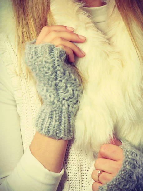istock Sensitive female hands with gray gloves. 872746306