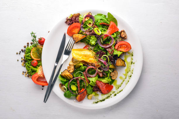 istock Brie cheese with grilled vegetables. Top view. Free space for text. On a wooden background. 872750048