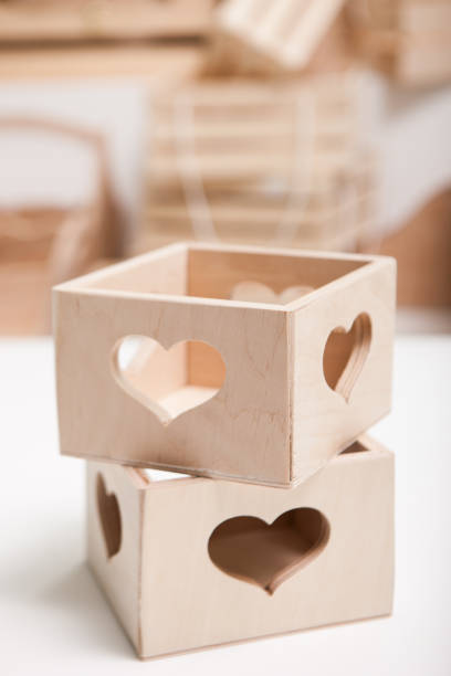Close up two wooden boxes on white table