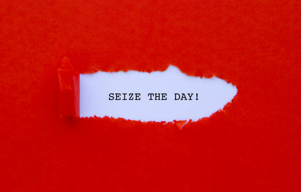Seize The Day Seize The Day written under torn paper. wasting time photos stock pictures, royalty-free photos & images