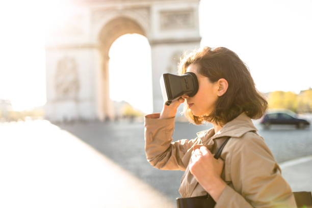istock tourist woman using a virtual reality device in paris 872758546
