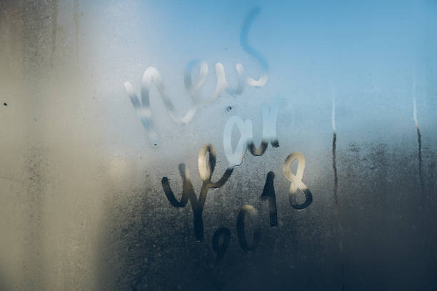 istock 2018 written on the wet window 872758820